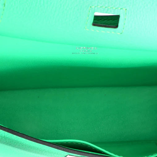 Inside the Hermes Jypsiere Mini showing space for iPhone and essentials